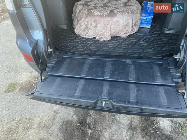 Серый Мицубиси Аутлендер, объемом двигателя 1.97 л и пробегом 257 тыс. км за 9000 $, фото 11 на Automoto.ua