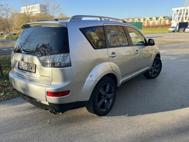 Серый Мицубиси Аутлендер, объемом двигателя 2 л и пробегом 255 тыс. км за 3935 $, фото 2 на Automoto.ua