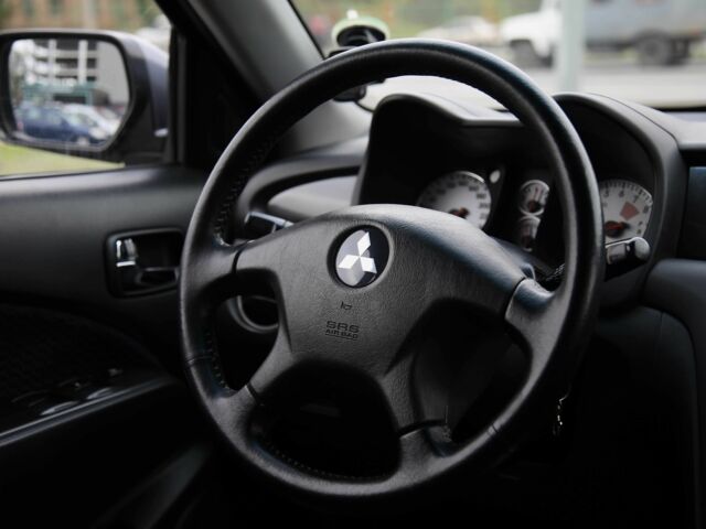 Серый Мицубиси Аутлендер, объемом двигателя 2.4 л и пробегом 240 тыс. км за 7200 $, фото 14 на Automoto.ua