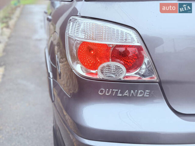 Серый Мицубиси Аутлендер, объемом двигателя 2.4 л и пробегом 240 тыс. км за 6900 $, фото 59 на Automoto.ua
