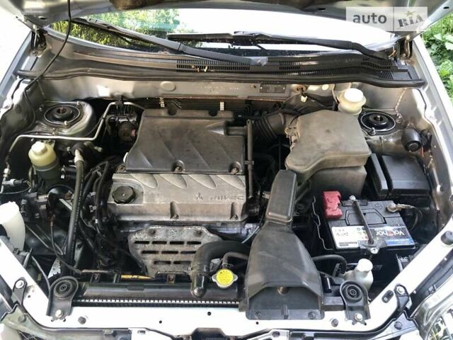 Сірий Міцубісі Аутлендер, об'ємом двигуна 2.4 л та пробігом 270 тис. км за 6700 $, фото 13 на Automoto.ua