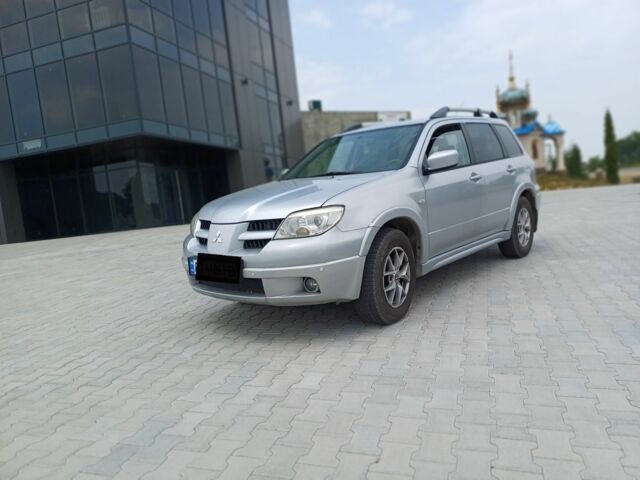 Серый Мицубиси Аутлендер, объемом двигателя 2.4 л и пробегом 243 тыс. км за 6200 $, фото 5 на Automoto.ua