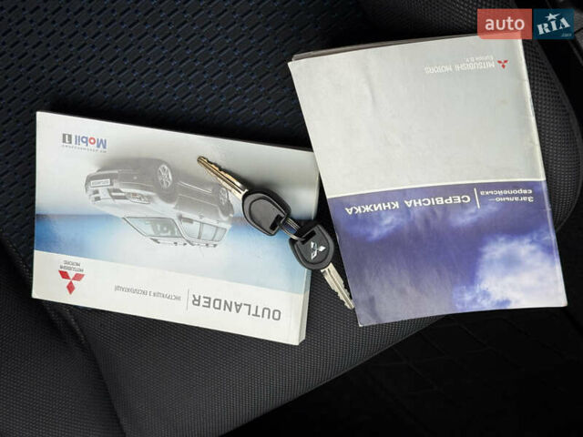 Серый Мицубиси Аутлендер, объемом двигателя 2.4 л и пробегом 240 тыс. км за 6900 $, фото 2 на Automoto.ua