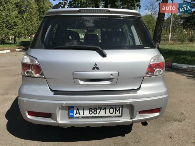 Серый Мицубиси Аутлендер, объемом двигателя 2.38 л и пробегом 182 тыс. км за 5850 $, фото 2 на Automoto.ua