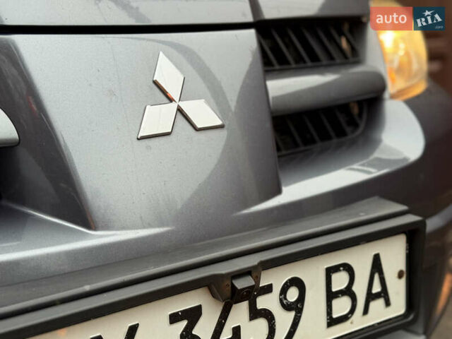 Серый Мицубиси Аутлендер, объемом двигателя 2.4 л и пробегом 240 тыс. км за 6900 $, фото 30 на Automoto.ua