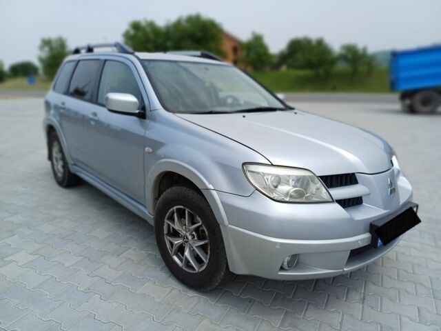 Серый Мицубиси Аутлендер, объемом двигателя 2.4 л и пробегом 243 тыс. км за 6200 $, фото 3 на Automoto.ua