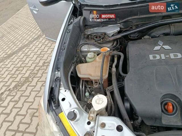 Серый Мицубиси Аутлендер, объемом двигателя 2 л и пробегом 332 тыс. км за 7650 $, фото 28 на Automoto.ua