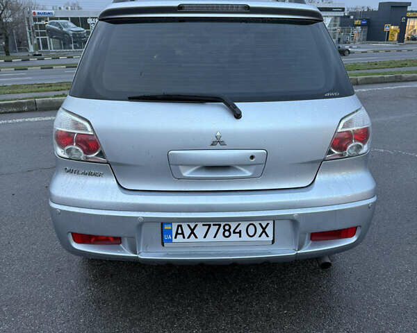 Сірий Міцубісі Аутлендер, об'ємом двигуна 2.4 л та пробігом 190 тис. км за 7500 $, фото 4 на Automoto.ua
