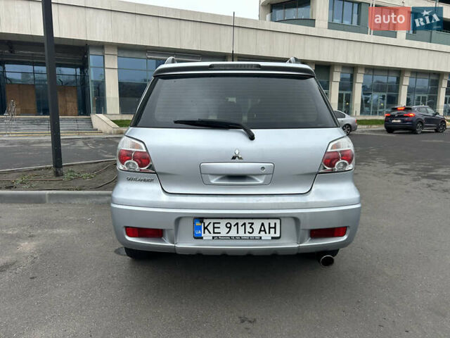 Серый Мицубиси Аутлендер, объемом двигателя 2.38 л и пробегом 81 тыс. км за 8700 $, фото 4 на Automoto.ua