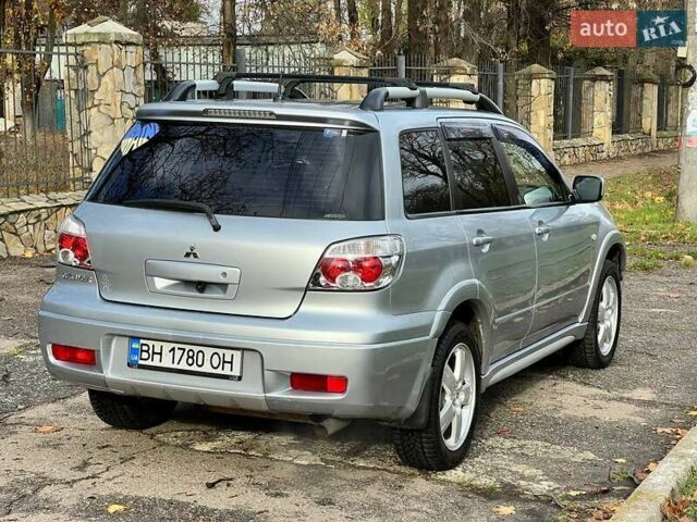 Серый Мицубиси Аутлендер, объемом двигателя 2.38 л и пробегом 170 тыс. км за 6900 $, фото 9 на Automoto.ua