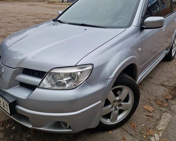 Серый Мицубиси Аутлендер, объемом двигателя 2.38 л и пробегом 113 тыс. км за 8900 $, фото 5 на Automoto.ua