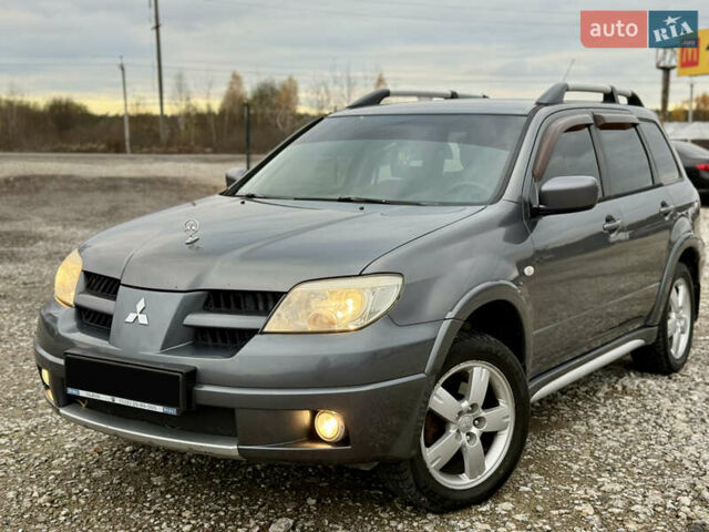 Серый Мицубиси Аутлендер, объемом двигателя 2 л и пробегом 199 тыс. км за 5999 $, фото 4 на Automoto.ua