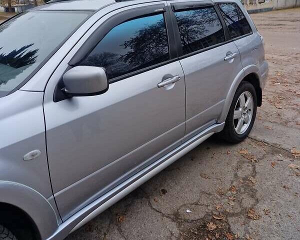Серый Мицубиси Аутлендер, объемом двигателя 2.38 л и пробегом 113 тыс. км за 8900 $, фото 11 на Automoto.ua