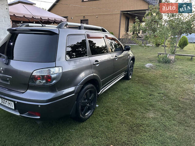 Сірий Міцубісі Аутлендер, об'ємом двигуна 2.38 л та пробігом 273 тис. км за 8000 $, фото 3 на Automoto.ua