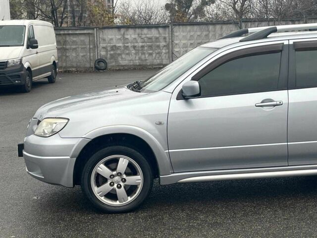 Сірий Міцубісі Аутлендер, об'ємом двигуна 2.4 л та пробігом 324 тис. км за 6890 $, фото 5 на Automoto.ua