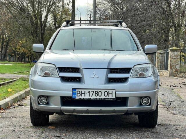Серый Мицубиси Аутлендер, объемом двигателя 2.4 л и пробегом 170 тыс. км за 6900 $, фото 2 на Automoto.ua