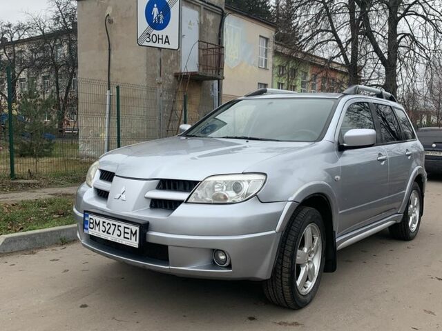 Серый Мицубиси Аутлендер, объемом двигателя 2 л и пробегом 247 тыс. км за 5999 $, фото 4 на Automoto.ua