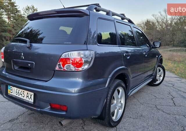 Серый Мицубиси Аутлендер, объемом двигателя 2 л и пробегом 157 тыс. км за 8300 $, фото 7 на Automoto.ua