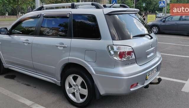 Серый Мицубиси Аутлендер, объемом двигателя 2.38 л и пробегом 323 тыс. км за 6800 $, фото 18 на Automoto.ua
