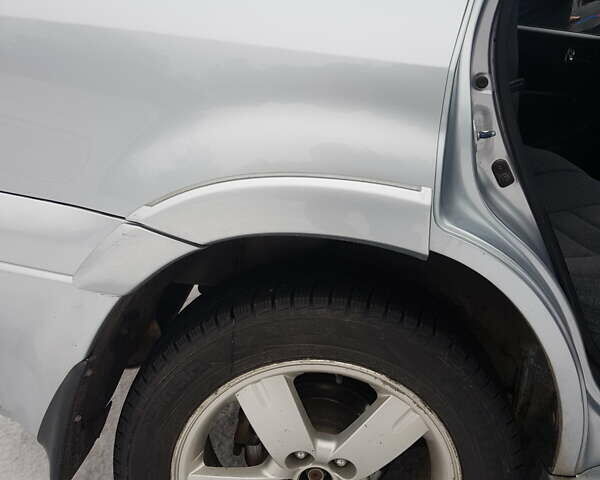 Серый Мицубиси Аутлендер, объемом двигателя 2.38 л и пробегом 700 тыс. км за 7058 $, фото 4 на Automoto.ua