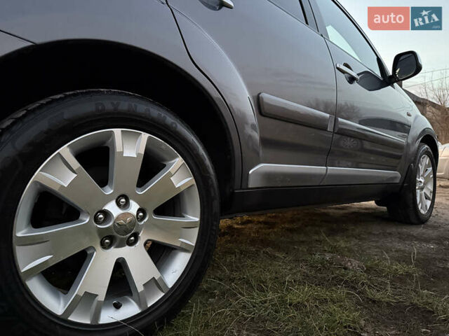 Сірий Міцубісі Аутлендер, об'ємом двигуна 2 л та пробігом 235 тис. км за 8950 $, фото 69 на Automoto.ua