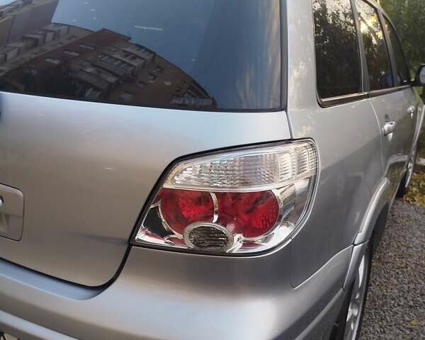 Сірий Міцубісі Аутлендер, об'ємом двигуна 2.38 л та пробігом 209 тис. км за 7460 $, фото 10 на Automoto.ua