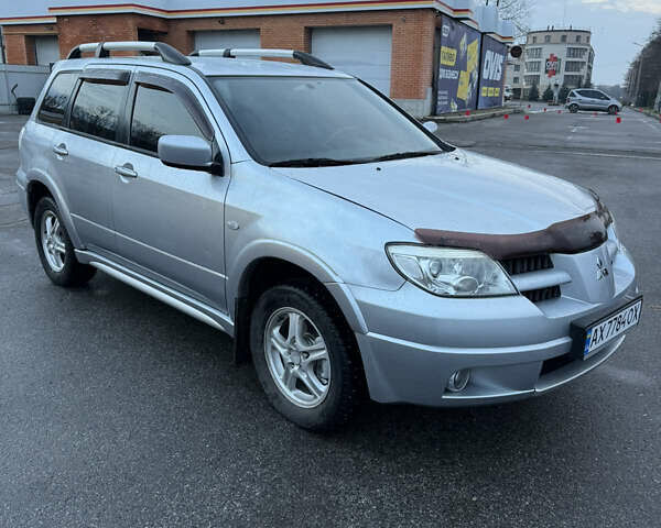 Сірий Міцубісі Аутлендер, об'ємом двигуна 2.4 л та пробігом 190 тис. км за 7500 $, фото 2 на Automoto.ua