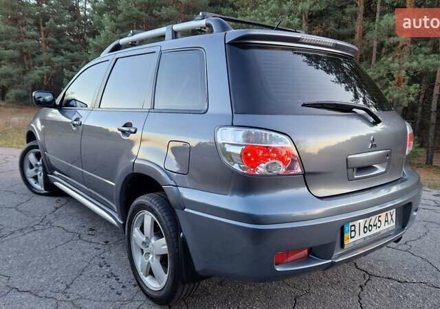 Серый Мицубиси Аутлендер, объемом двигателя 2 л и пробегом 157 тыс. км за 8300 $, фото 6 на Automoto.ua
