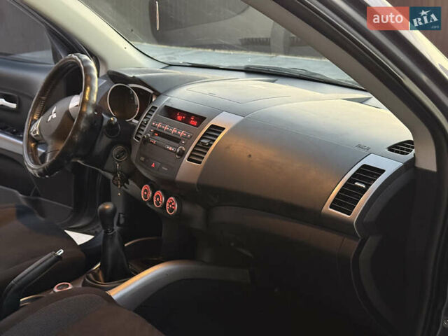 Серый Мицубиси Аутлендер, объемом двигателя 2.4 л и пробегом 210 тыс. км за 8300 $, фото 31 на Automoto.ua