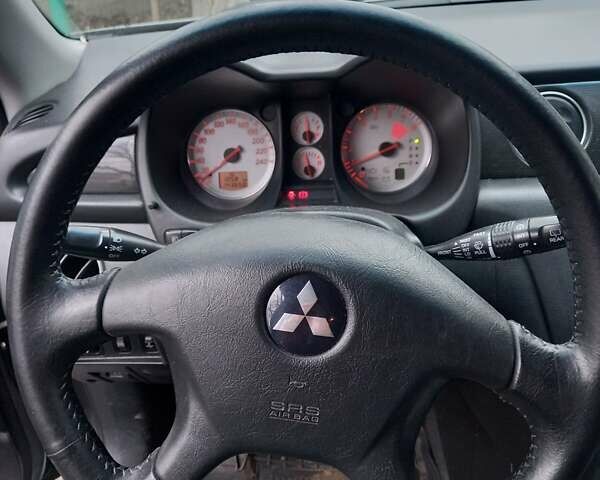 Серый Мицубиси Аутлендер, объемом двигателя 2.38 л и пробегом 143 тыс. км за 7300 $, фото 12 на Automoto.ua