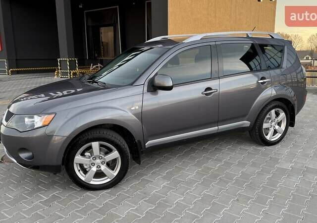 Серый Мицубиси Аутлендер, объемом двигателя 2.4 л и пробегом 174 тыс. км за 9599 $, фото 2 на Automoto.ua