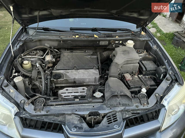 Сірий Міцубісі Аутлендер, об'ємом двигуна 2.38 л та пробігом 273 тис. км за 8000 $, фото 17 на Automoto.ua