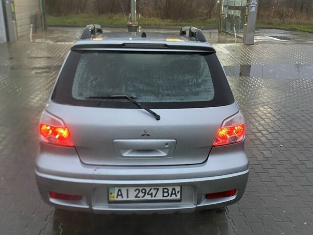 Сірий Міцубісі Аутлендер, об'ємом двигуна 2.4 л та пробігом 299 тис. км за 6300 $, фото 2 на Automoto.ua