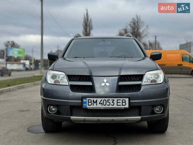 Серый Мицубиси Аутлендер, объемом двигателя 2.38 л и пробегом 254 тыс. км за 7300 $, фото 4 на Automoto.ua