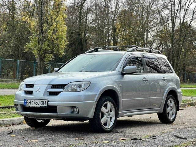 Серый Мицубиси Аутлендер, объемом двигателя 2.4 л и пробегом 170 тыс. км за 6900 $, фото 1 на Automoto.ua