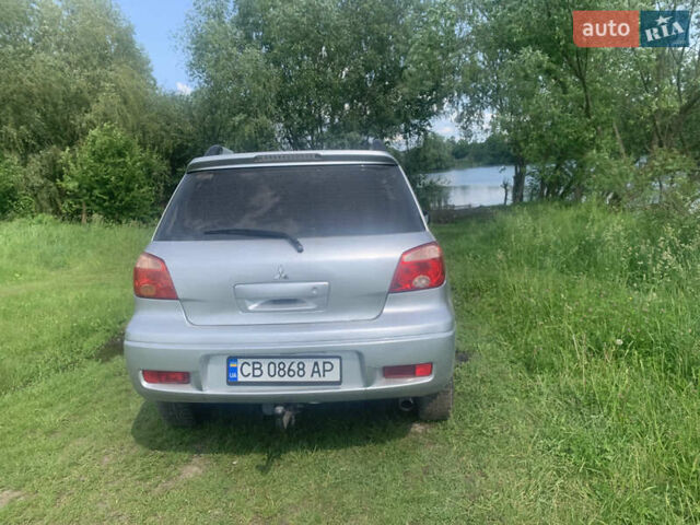 Сірий Міцубісі Аутлендер, об'ємом двигуна 2 л та пробігом 210 тис. км за 4500 $, фото 2 на Automoto.ua