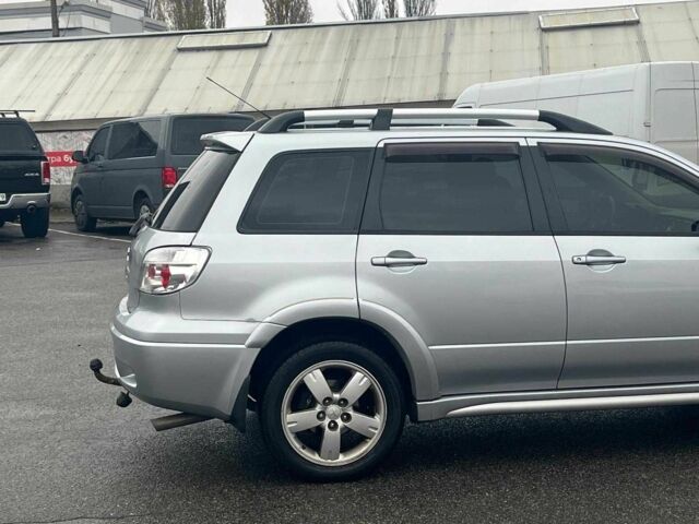 Сірий Міцубісі Аутлендер, об'ємом двигуна 2.4 л та пробігом 324 тис. км за 6890 $, фото 12 на Automoto.ua