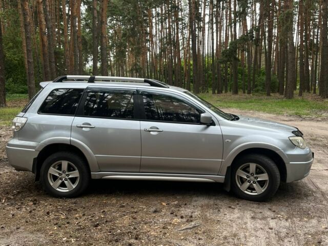Серый Мицубиси Аутлендер, объемом двигателя 2.4 л и пробегом 225 тыс. км за 6500 $, фото 4 на Automoto.ua