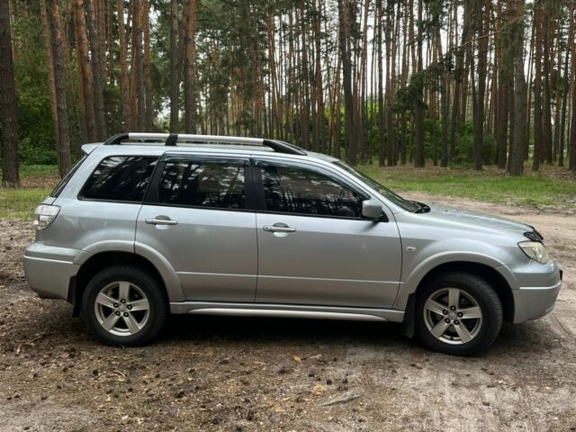 Серый Мицубиси Аутлендер, объемом двигателя 2.4 л и пробегом 225 тыс. км за 6500 $, фото 7 на Automoto.ua