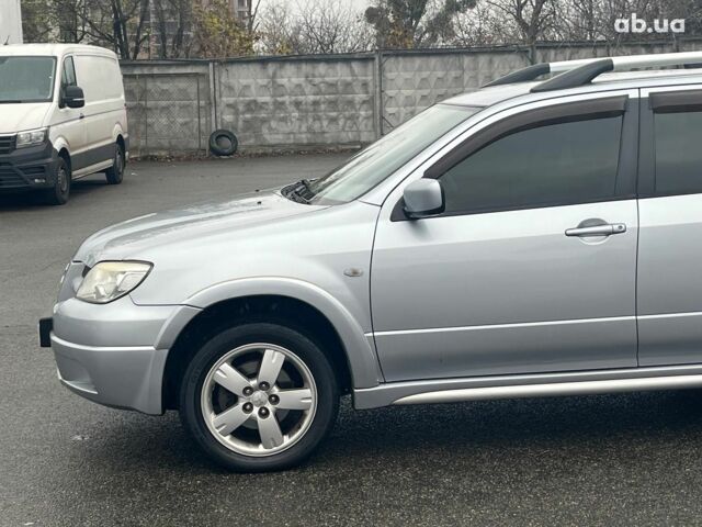 Серый Мицубиси Аутлендер, объемом двигателя 2.4 л и пробегом 324 тыс. км за 6890 $, фото 4 на Automoto.ua
