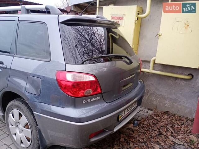 Серый Мицубиси Аутлендер, объемом двигателя 2 л и пробегом 300 тыс. км за 6000 $, фото 4 на Automoto.ua