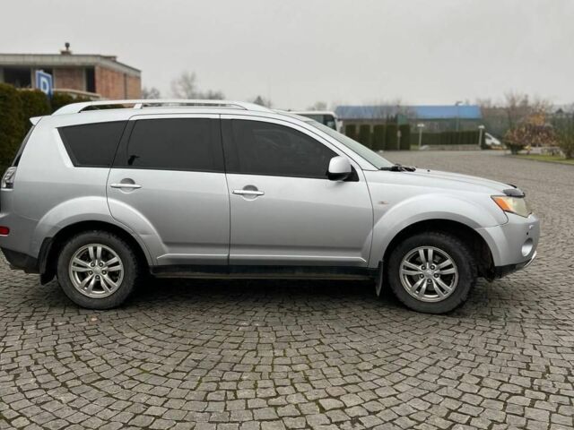 Серый Мицубиси Аутлендер, объемом двигателя 2.4 л и пробегом 285 тыс. км за 8500 $, фото 2 на Automoto.ua