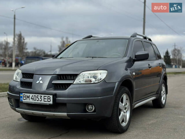 Серый Мицубиси Аутлендер, объемом двигателя 2.38 л и пробегом 254 тыс. км за 7300 $, фото 1 на Automoto.ua