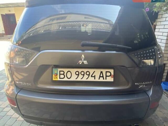 Серый Мицубиси Аутлендер, объемом двигателя 3 л и пробегом 232 тыс. км за 9200 $, фото 1 на Automoto.ua
