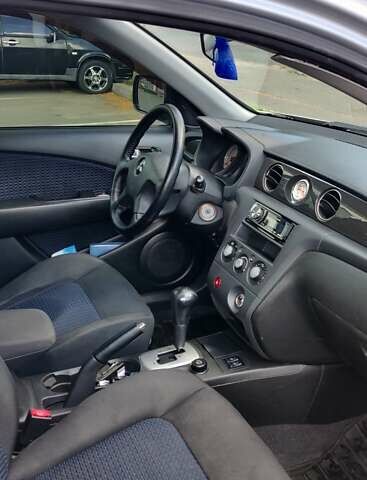 Серый Мицубиси Аутлендер, объемом двигателя 2.38 л и пробегом 323 тыс. км за 6800 $, фото 13 на Automoto.ua