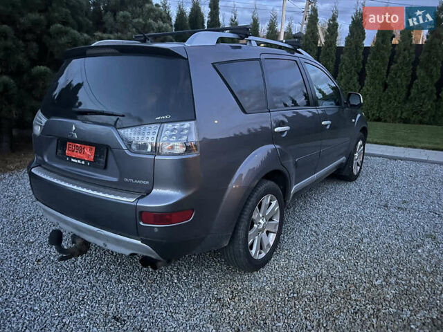 Серый Мицубиси Аутлендер, объемом двигателя 2 л и пробегом 235 тыс. км за 9000 $, фото 4 на Automoto.ua