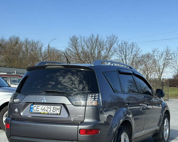 Серый Мицубиси Аутлендер, объемом двигателя 2.36 л и пробегом 215 тыс. км за 8000 $, фото 3 на Automoto.ua