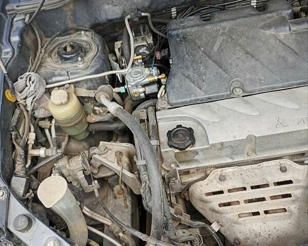 Серый Мицубиси Аутлендер, объемом двигателя 2.35 л и пробегом 342 тыс. км за 6900 $, фото 13 на Automoto.ua