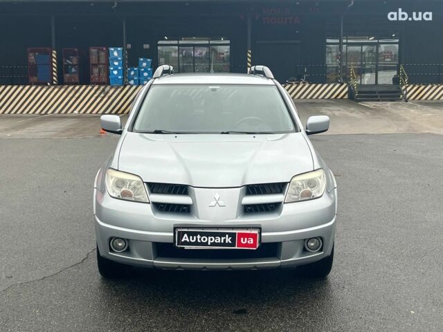 Серый Мицубиси Аутлендер, объемом двигателя 2.4 л и пробегом 324 тыс. км за 6890 $, фото 1 на Automoto.ua