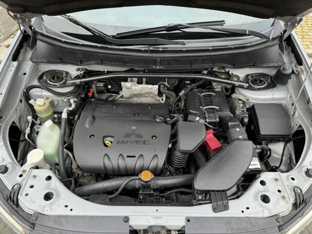 Серый Мицубиси Аутлендер, объемом двигателя 2.4 л и пробегом 241 тыс. км за 7350 $, фото 11 на Automoto.ua